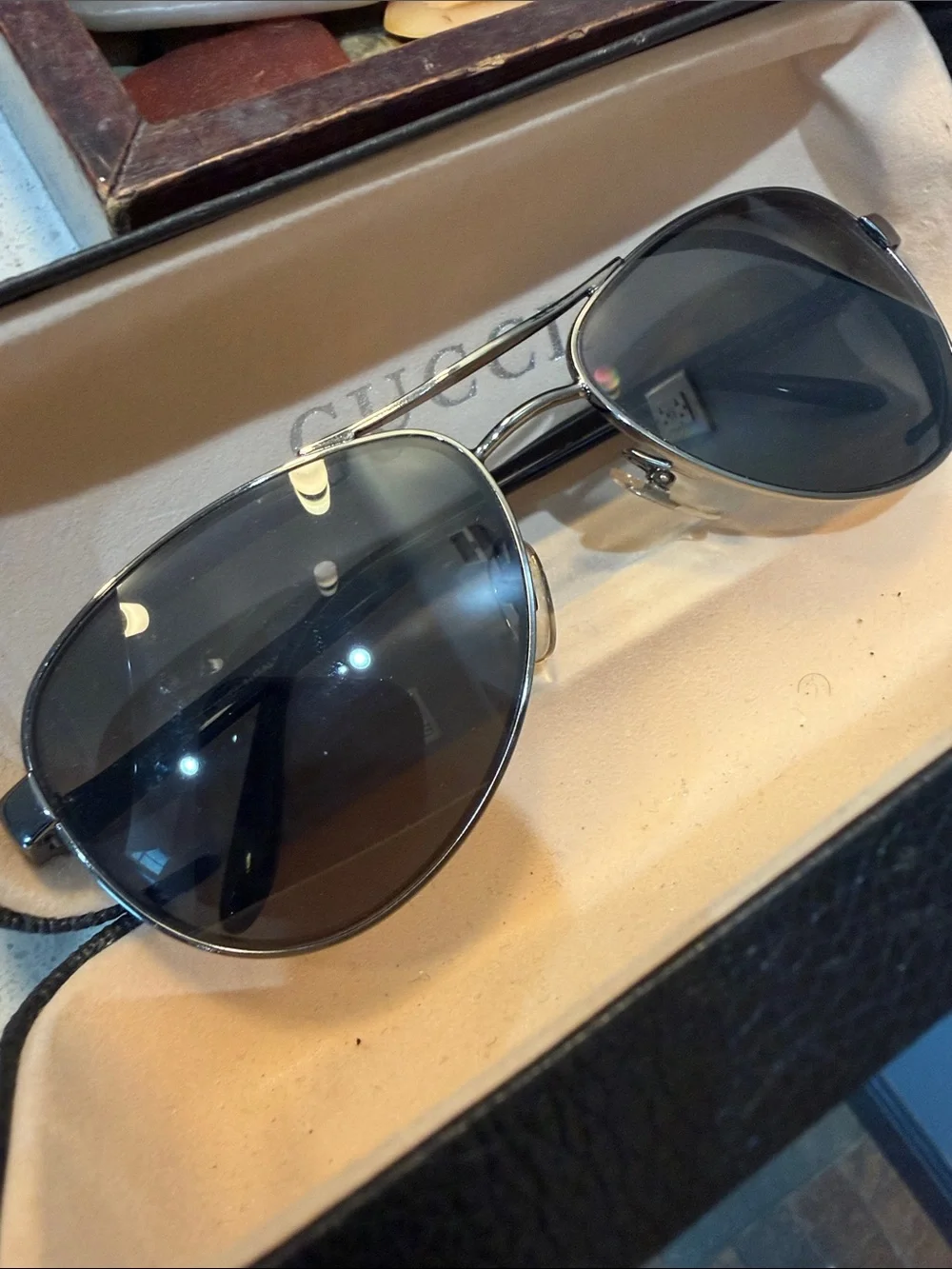 Gucci Men's Black Oval Sunglasses with Silver Accents